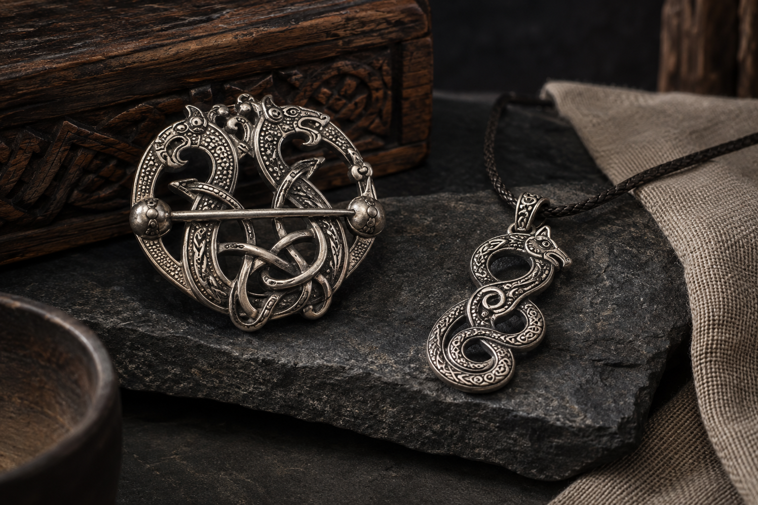 Silver Viking-inspired animal interlace brooch and serpentine pendant